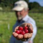 Alan holding cherries